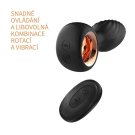 Černý rotační anální kolík BASIC X Ziggi s kovovým akcentem a dalším černým ovládacím zařízením.