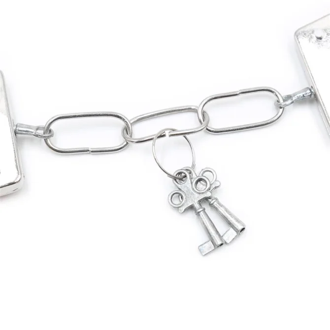 BDSM Line kovová pouta oplyšovaná růžová